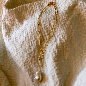 Anthropologie chain gold tone necklace with faux Pearl drop.